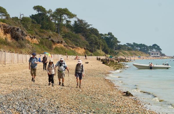 ramblers on shoreline at Lepe